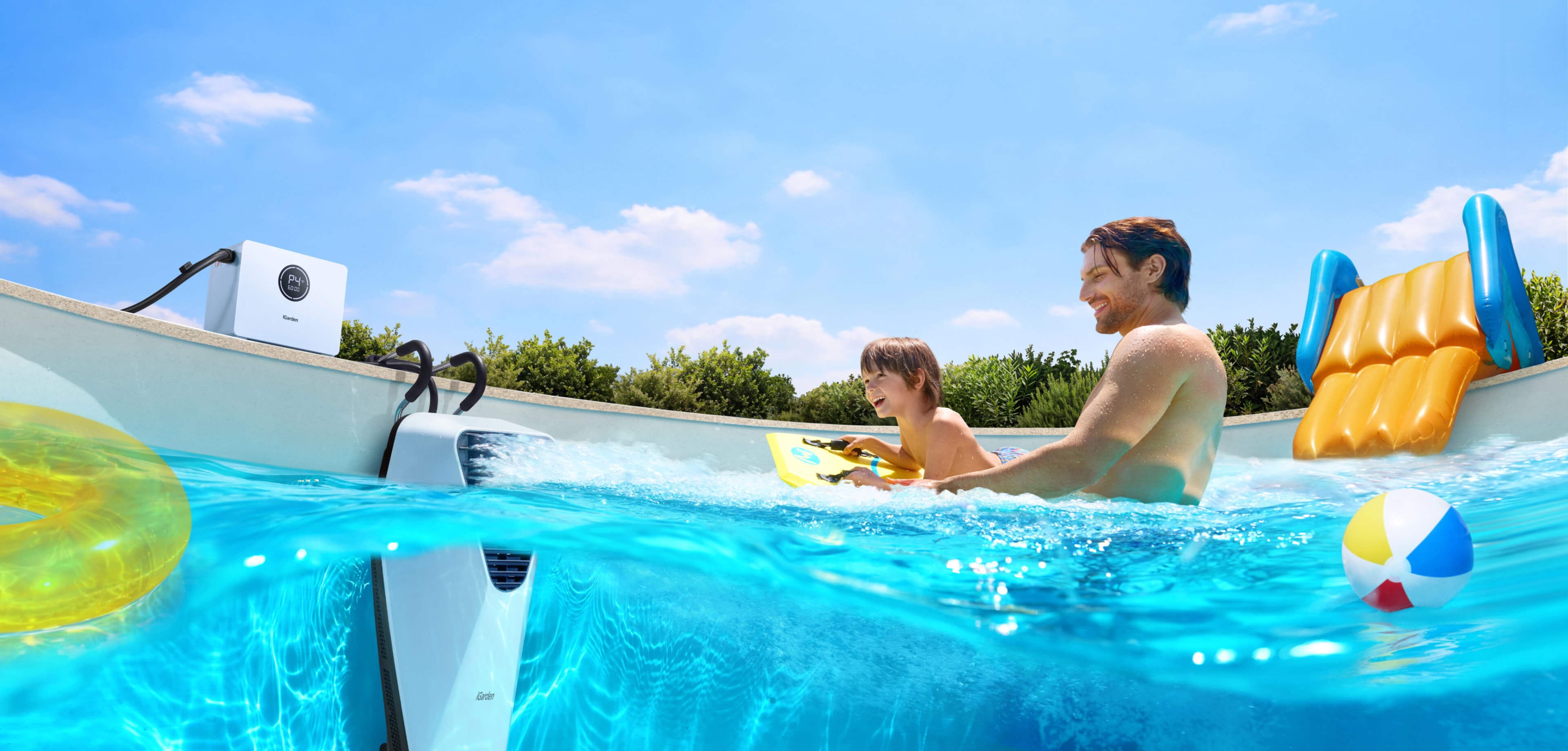 A father and son enjoy family fun with the iGarden Swim Jet X Portable Swim Jet in an in-ground pool.