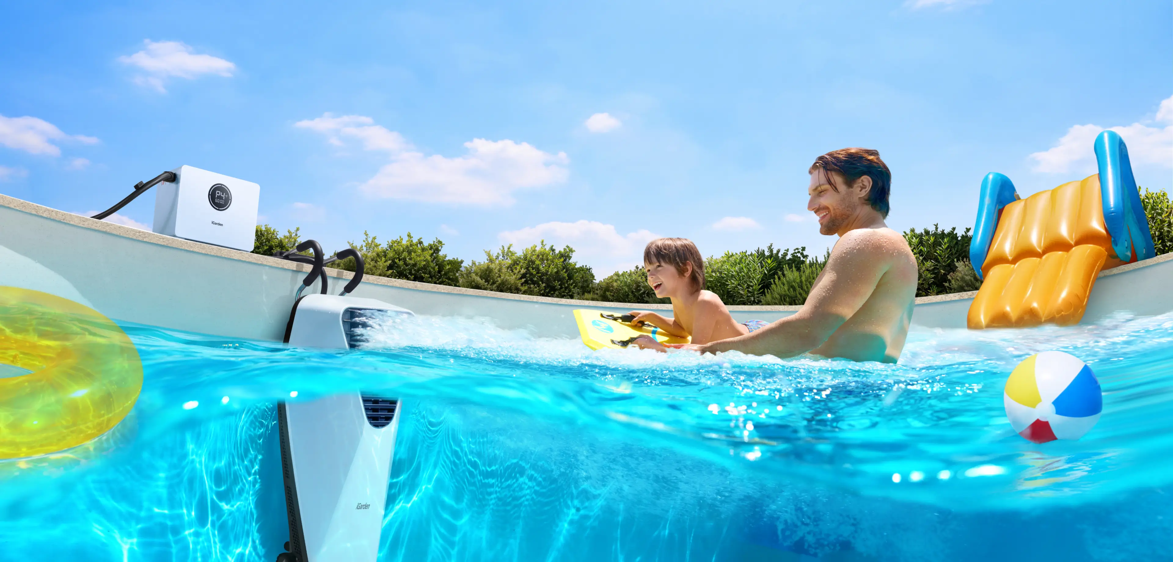 A father and son enjoy family fun with the iGarden Swim Jet X Portable Swim Jet in an in-ground pool.