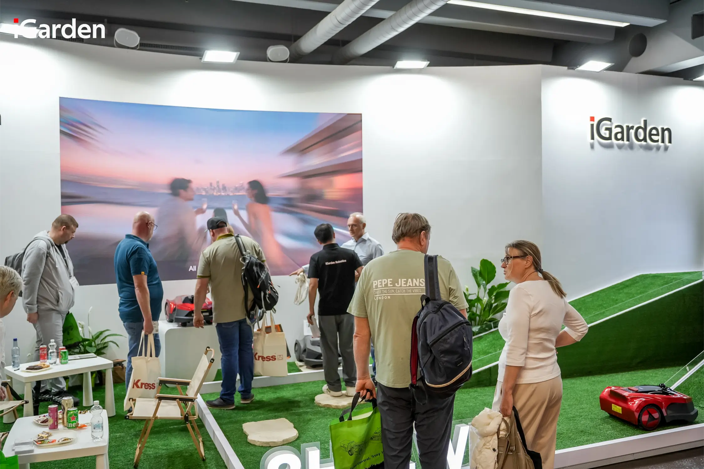 Visitors and Clients check iGarden Robotic Lawn Mower L-AWD Series at iGarden Green Lawn Smart Garden Ecosystem Booth in GaLaBau 2026